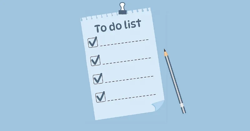 Một danh sách công việc (to-do list) được viết tay hoặc in, đặt cùng cây bút bi trên bàn làm việc, biểu thị việc biến ước mơ thành các mục tiêu và kế hoạch hành động cụ thể